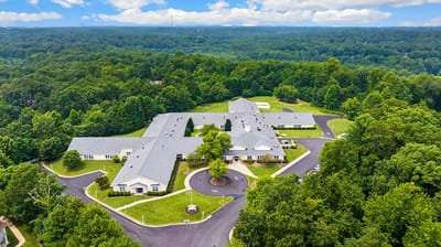 Aerial view of the assisted living facility surrounded by greenery
