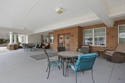 Outdoor seating area with tables and chairs