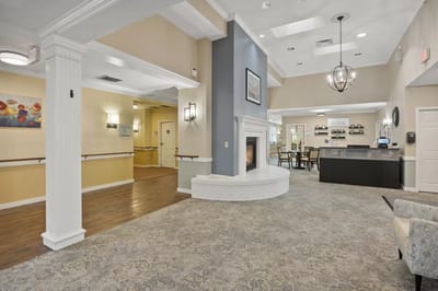 Interior view of a common area with seating and a fireplace