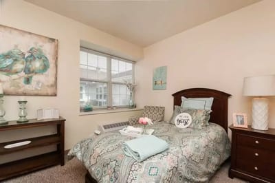 Cozy resident room with bed and decorative elements