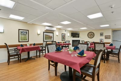 Dining room with neatly set tables and decor