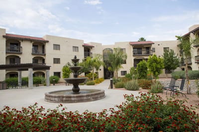 Outdoor courtyard with fountain and landscaping
