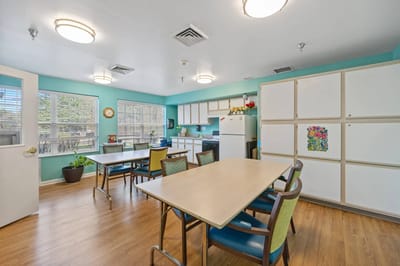 Bright common area with tables and chairs