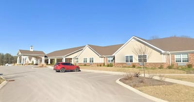 Exterior view of the assisted living facility with parking area