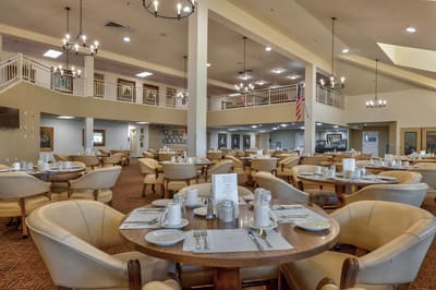 Dining area set up for residents with tables and chairs