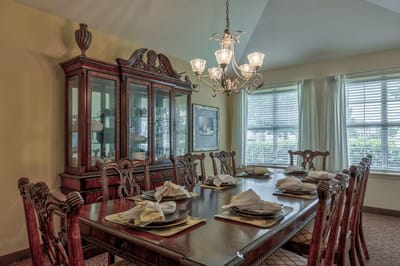 Elegant dining room set for a meal.