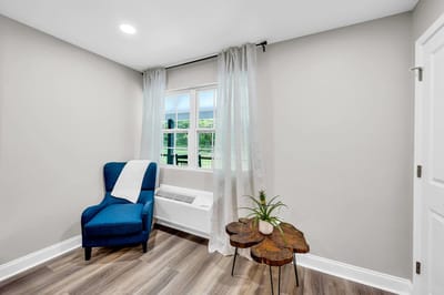 Cozy corner in a resident room with chair and table