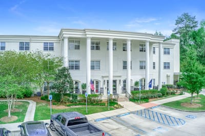 Exterior view of a senior living facility with columns