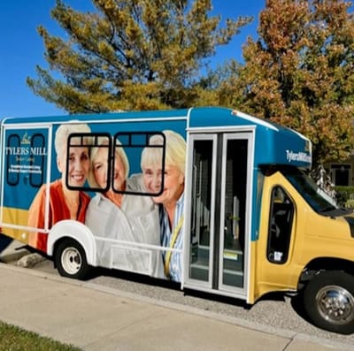 Facility transportation van with smiling residents