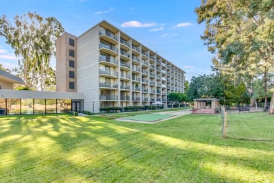 View of the West Park Senior Living building and lawn