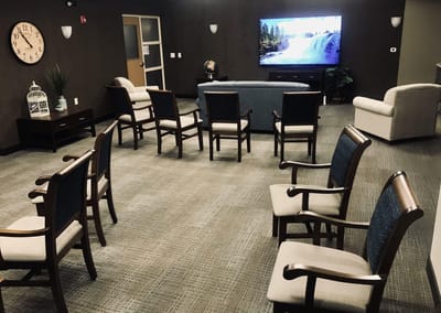 Interior common area with seating and a television
