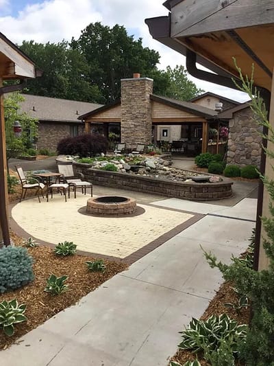 Outdoor space with a stone water feature and seating