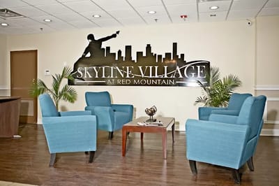 Bright common area with seating and facility branding