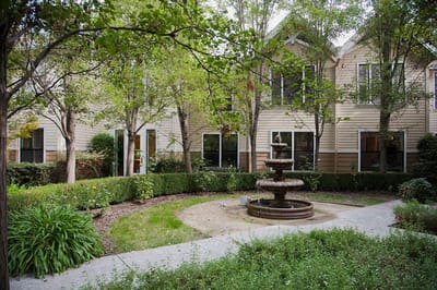 Well-maintained garden area with a fountain