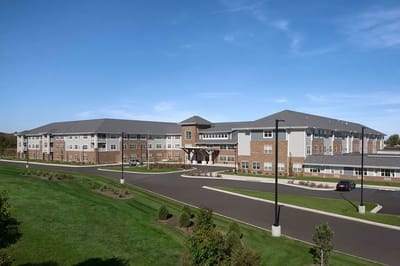 Exterior view of StoryPoint Schererville facility with landscaped grounds
