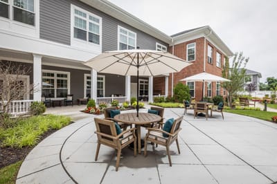Outdoor seating area with tables and umbrellas
