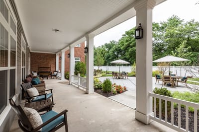 Covered outdoor seating area with umbrellas and plants