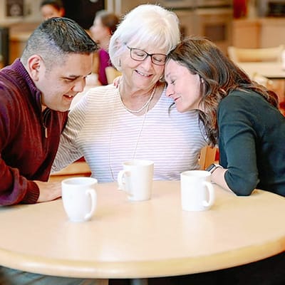 Residents and staff enjoying a moment together in a common area