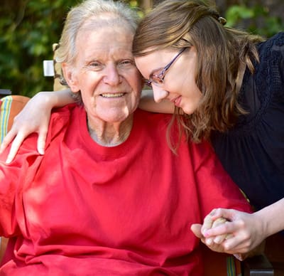 Resident enjoying a joyful moment with staff