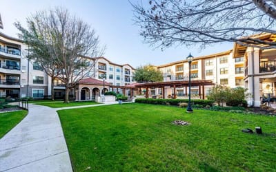 Beautiful outdoor space with landscaped gardens and building facades