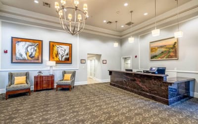 Bright lobby area with seating and reception desk