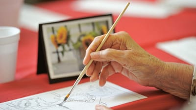 Senior resident engaging in art activity