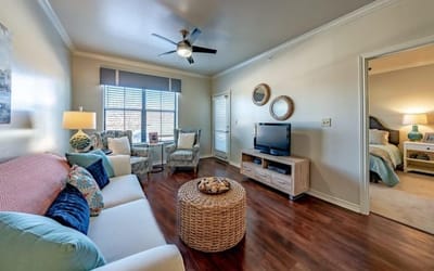 Brightly decorated living room in a resident unit
