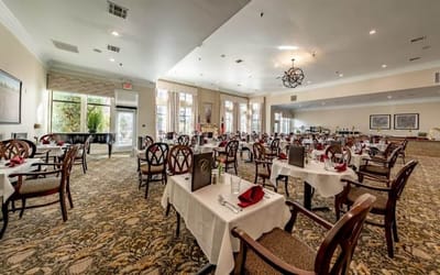 Elegant dining room with tables set for a meal