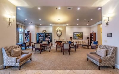 Interior common area with seating and bookshelves