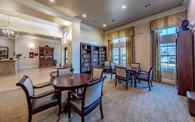 Cozy common area with seating and bookshelves