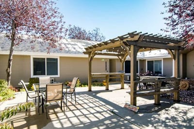 Outdoor space with a pergola and tables