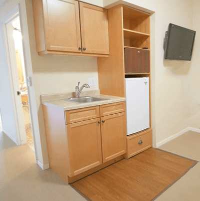 A kitchenette area in a resident room