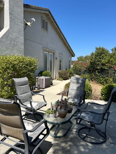 Outdoor patio seating area with plants