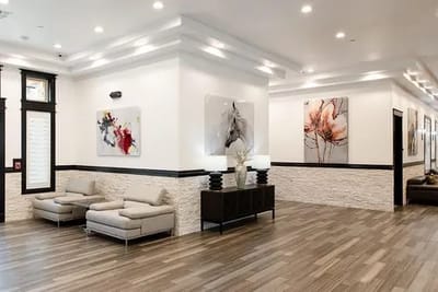 Interior view of a modern lobby with seating and artwork