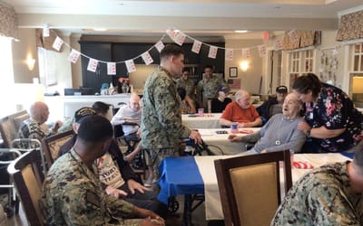 Residents and staff engaging in a festive social activity