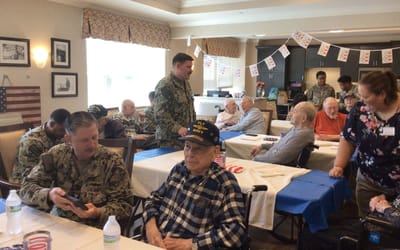 Residents interacting with military personnel during an event