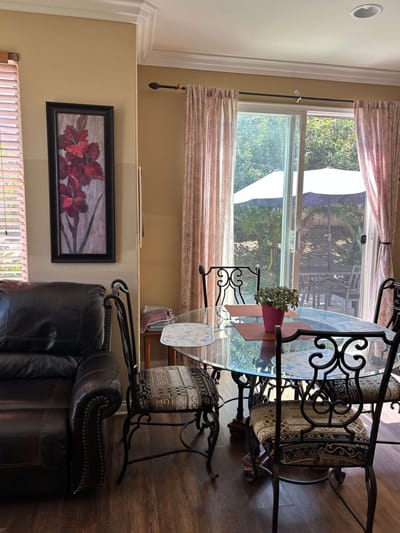 Cozy interior seating area with a dining table and view to the outside