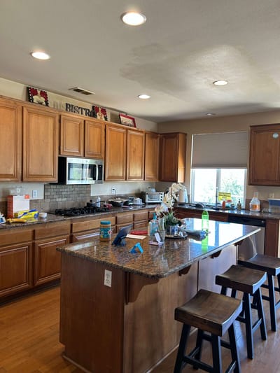 Interior kitchen with wooden cabinets and island