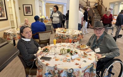 Residents enjoying a meal in a dining area