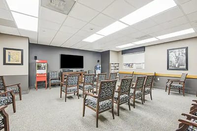 Common area with chairs and a television