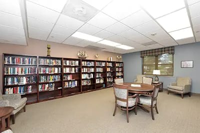 Bright common area with bookshelves and seating