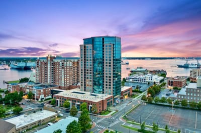 Aerial view of a large assisted living facility by the water