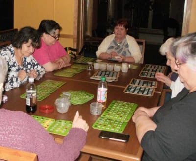 Residents enjoying a game of bingo in a communal space