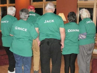 Residents wearing matching shirts in a common area