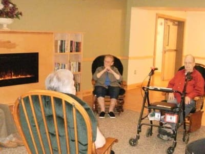 Residents engaged in a cozy common area