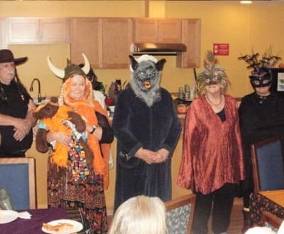 Residents in costumes during a festive activity.
