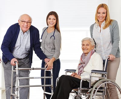 Staff helping residents in a bright common area