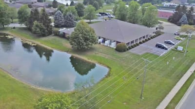 Aerial view of the assisted living facility with surrounding greenery