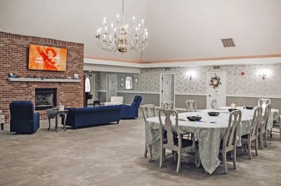 Bright common area with seating and dining tables