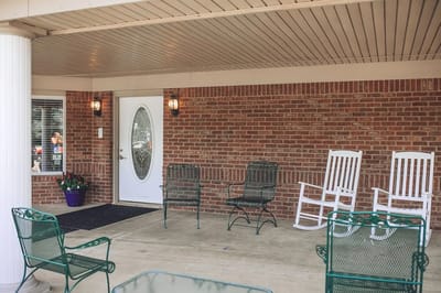 Front porch area with rocking chairs